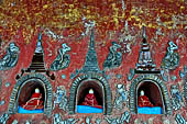 Myanmar, Burma, Nyaungshwe. Small Buddhas set into the temple wall, Shwe Yaunghwe Kyaung monastery, near Inle Lake. 